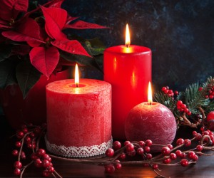 Christmas decor wirh red candles and poinsettia